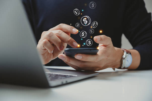 a man holding a phone to earn money